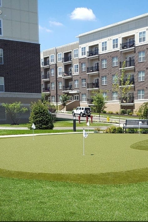 Putting green installed by apartment building