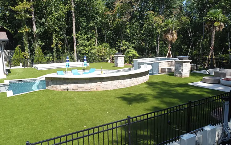 Artificial grass backyard pool area from SYNLawn